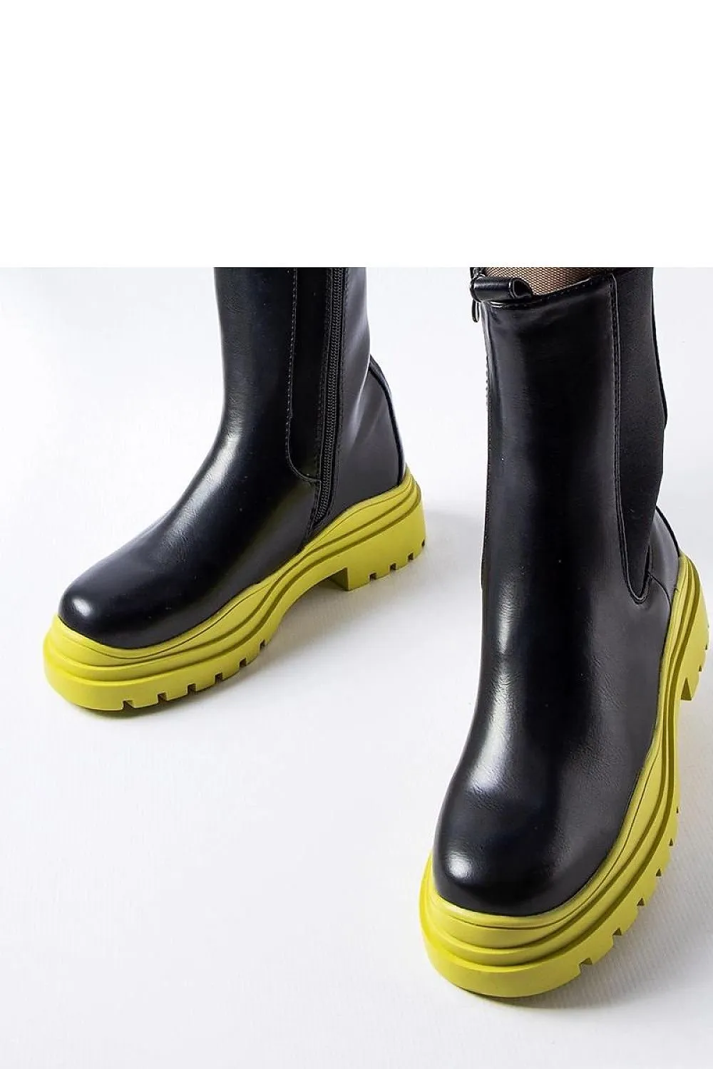 Black ankle boots with a colorful sole