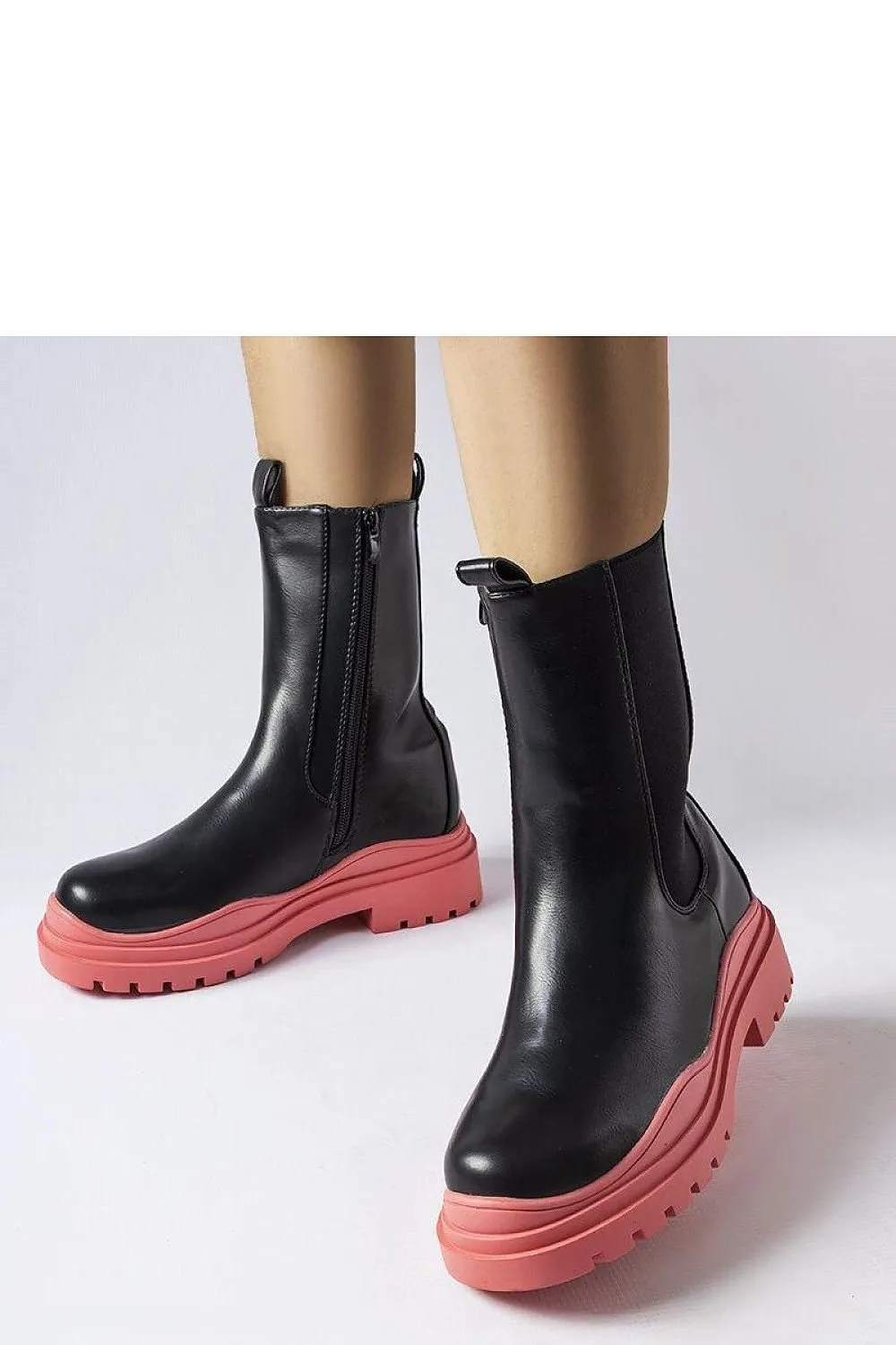Black ankle boots with a colorful sole
