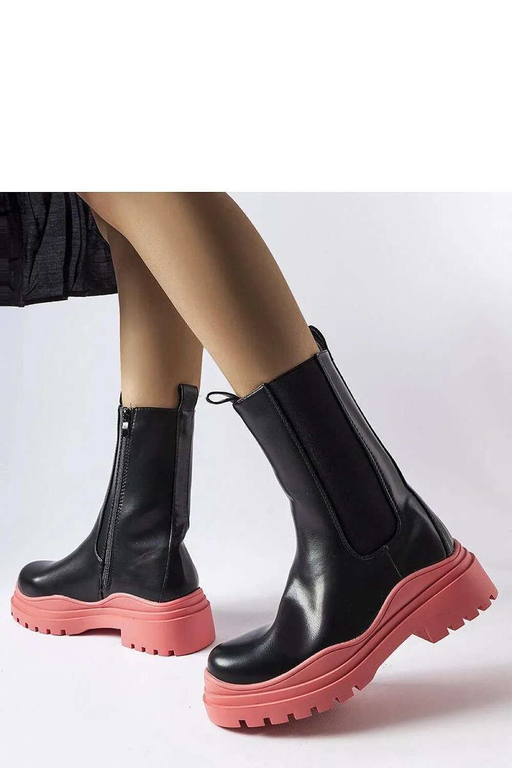 Black ankle boots with a colorful sole