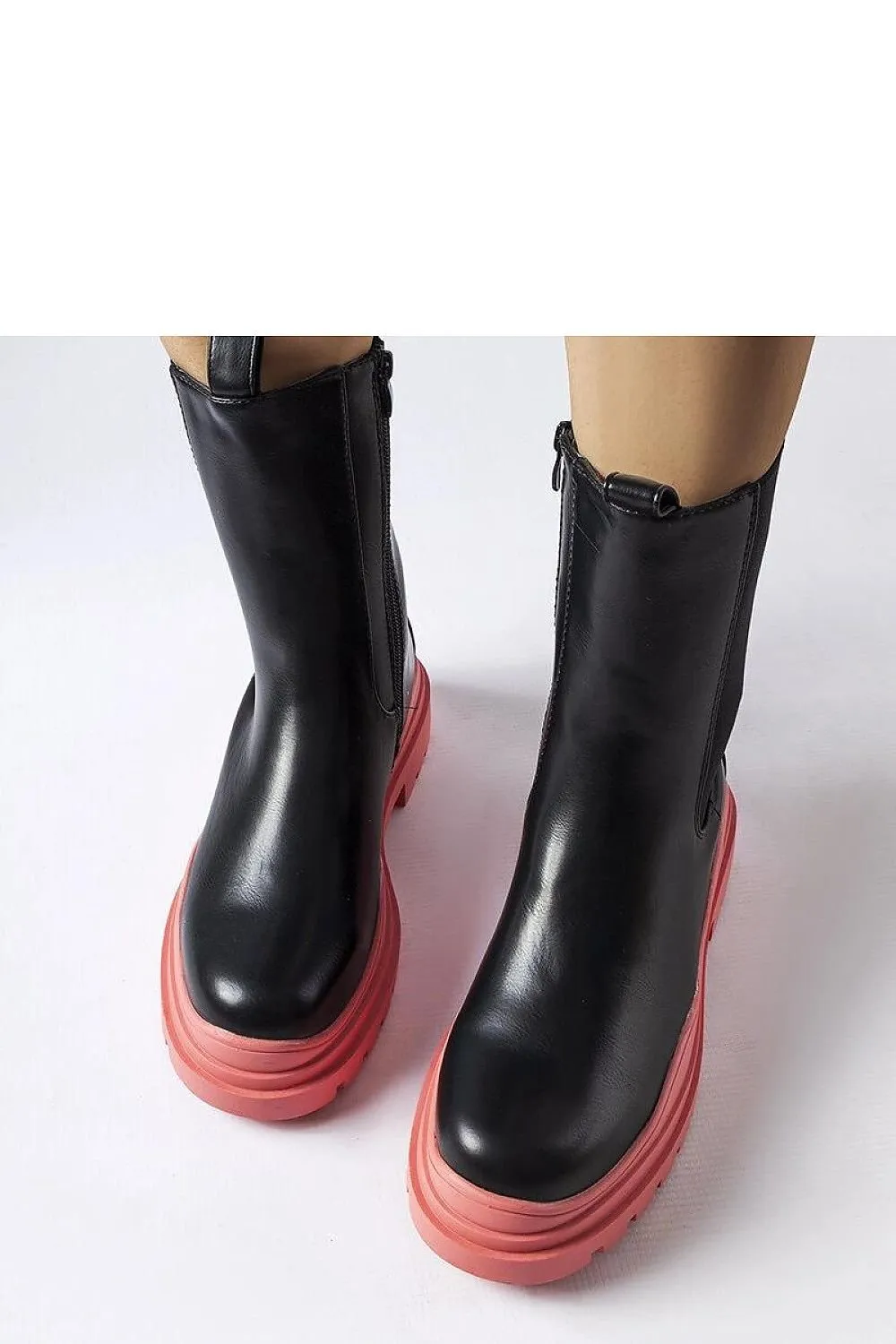 Black ankle boots with a colorful sole