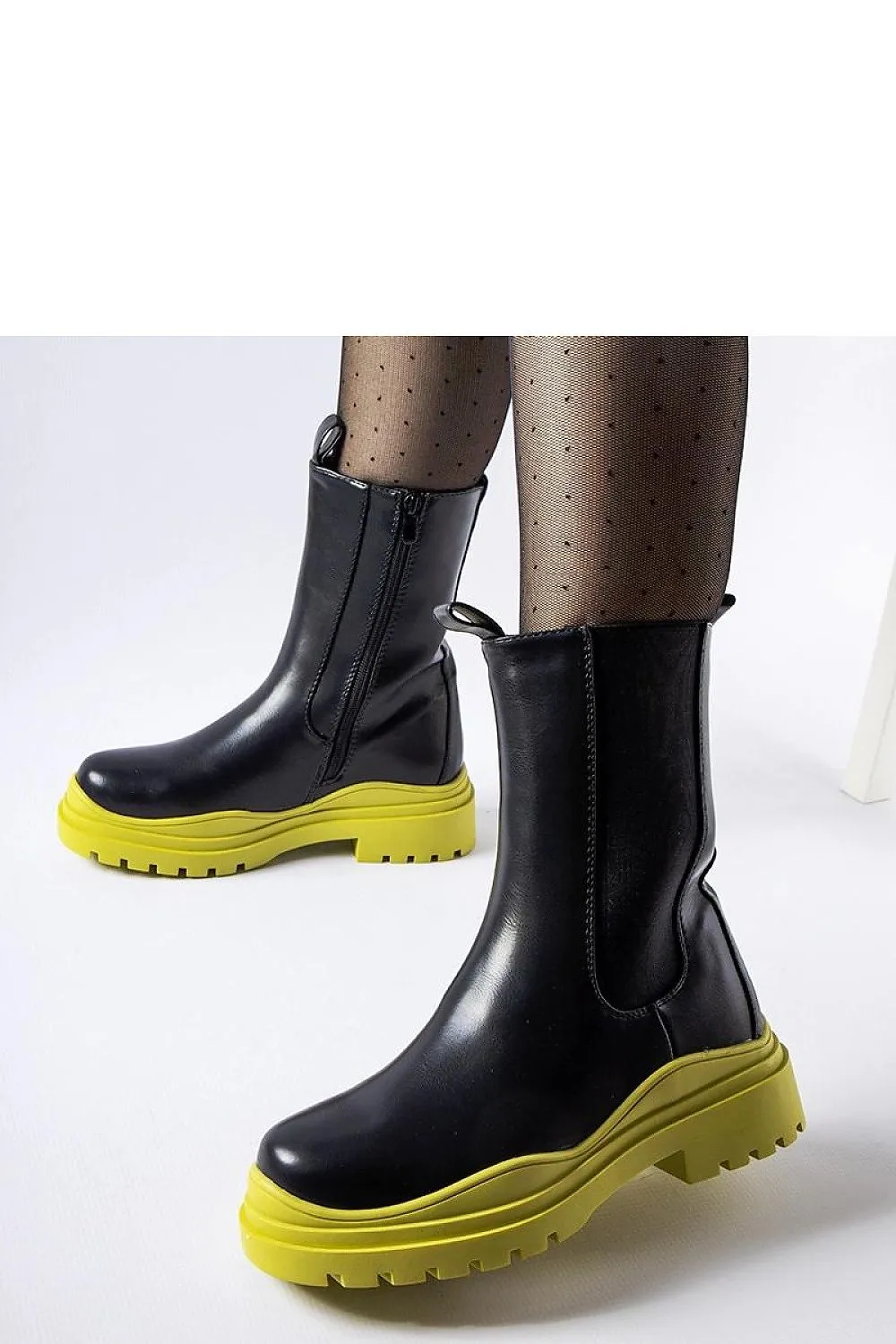 Black ankle boots with a colorful sole